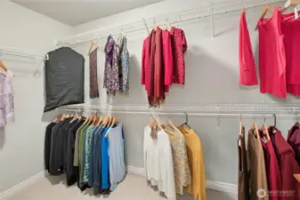 One of two walk-in closets in the primary bedroom.