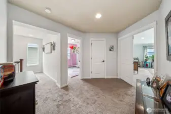Open landing at top of staircase doesn't  cramp this area into a small hallway.