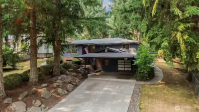 Home features extra deep garage and extra wide carport