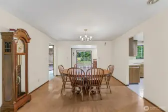 Left of dining room is a spacious hot tub room, family room beyond and kitchen to the right