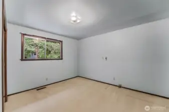 Bedroom 1 with front yard view.