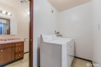 Utility room includes washer and dryer.