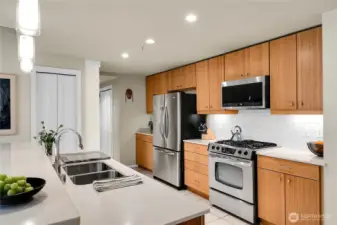 The updated kitchen features custom cabinetry and crisp white subway tiles.