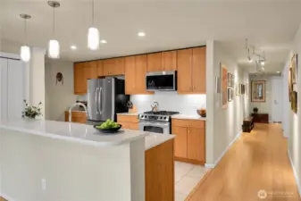 The kitchen bar is a great place to keep the cook company.