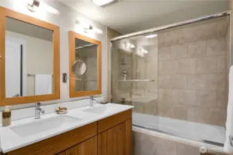 Here is the primary bath- offers two sinks and a deep bathtub for relaxing bubble baths.