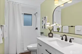 Main upper level bathroom with walk-in shower, quartz counters and under-mount sink.