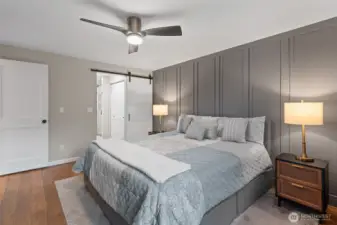 Primary bedroom with accent wall