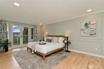Private primary suite with sitting area and view deck.