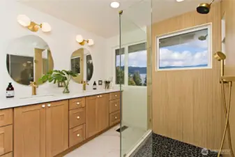 Spa-inspired, fully remodeled, primary bath with heated floors and mirrors.