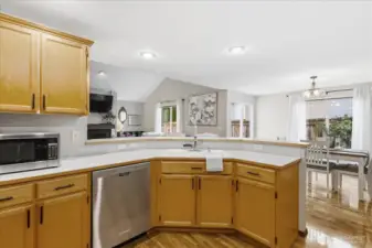 The kitchen offers a high bar with room for 4 chairs, stainless appliances and pantry space.