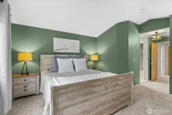 Primary ensuite offers vaulted ceilings, full bath and walk in closet.