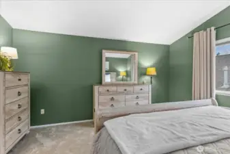 Primary ensuite offers vaulted ceilings, full bath and walk in closet.