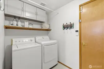Lower level laundry room, washer & dryer stay.