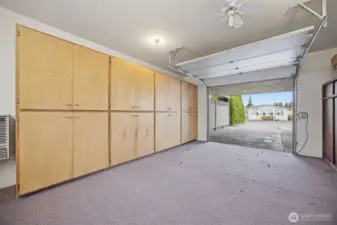Garage space offers ubundant storage and work space.