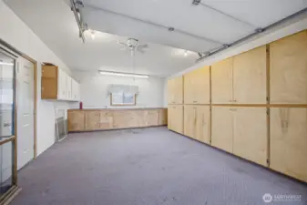 Garage space offers ubundant storage and work space.