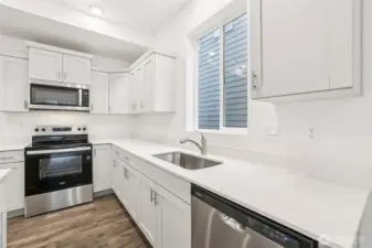 Kitchen with Whirlpool appliances -Photos are for representational purposes only, colors, elevation and features may vary.