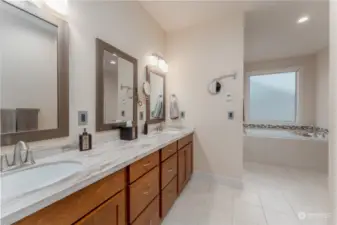 Double vanity, radiant heated floors in primary bathroom