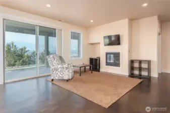 Cozy gas fireplace, sliding glass door out to covered patio