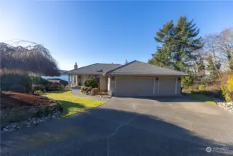 Three car attached garage and a lifetime tile roof. Plenty of driveway parking too!