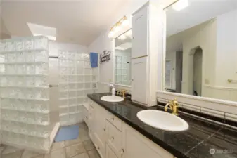 Walk in glass block shower and double vanity in Primary bath