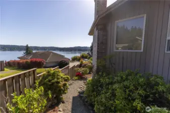 Walking path on the left side of the home to the spacious backyard