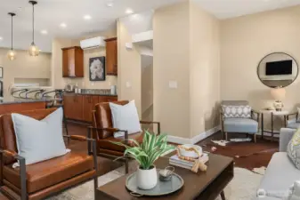 This view captures the abundant storage and counter space. Beyond the kitchen is the staircase leading down to the garage and lower living spaces.