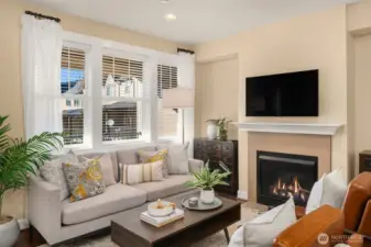 Enjoy the cozy gas fireplace in your living room. This picture window floods the space with tons of natural light.