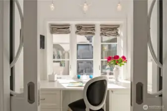 In the back hallway that leads to the kitchen is a small organization area (also with a great view!), and can be closed off with pocket doors.