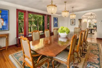 The scale of this formal dining room is incredible. Notice the 3 chandelier's over the table-these are from the Plaza hotel in New York!