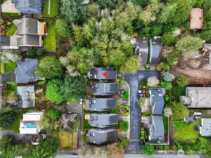 Overhead, you can see the rare setting the home offers with lush surroundings, yet minutes to everything you need