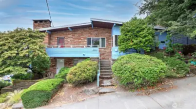 Incredible investment opportunity in the heart of Queen Anne — a rare triplex offering iconic views of the Space Needle, skyline & water. Please do not disturb tenants; showings by appt only. Each unit offers a cozy wood fireplace, w/Units 1 & 2 offering private decks to take in the stunning views. Unit 1 & its replica, Unit 2, are spacious 2-bed/1-bath layouts w/carpet/vinyl flooring & fully equipped kitchens. Unit 3 is a charming 1-bed, 1-bath w/hardwood floors in the living rm & vinyl in the kitchen. The property has 3 separate meters, baseboard heating throughout & on-site coin laundry. Whether you're looking to live in one unit & rent the others or expand your rental portfolio, this triplex delivers both location & long-term potential.
