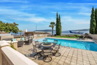 Lakefront views with an in-ground pool and hot tub. Boat house with spiral staircase leading to the helipad.
