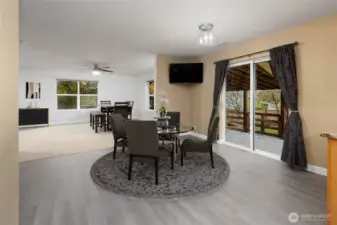 Kitchen nook and dining area, allowing open concept living with large covered patio for indoor and outdoor entertaining.