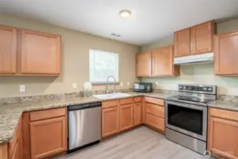 Spacious kitchen with new laminate floors