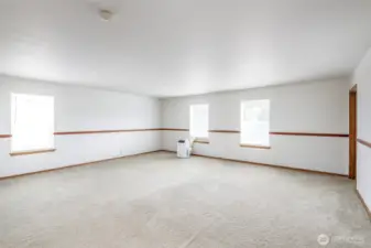This great room on the upper floor is wonderful entertaining space!