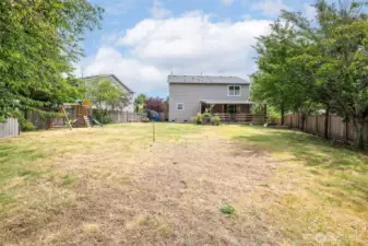 Huge back yard with playset and fully fenced