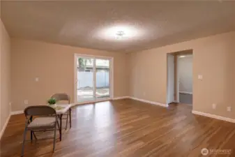 The living room is a nice size with sliders to outside.