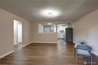 Livingroom looking towards the kitchen.  All new vinyl plank flooring