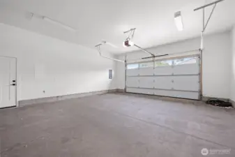 Oversized garage with plenty of room for storage plus a pull down attic door with more space which could be finished.