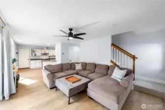 Bright living room has space for plenty of seating.