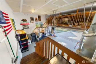 Garage has plenty of storage in loft area.