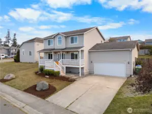 Large driveway makes room for extra parking and RV parking to the side.