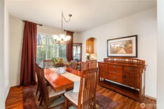 The dining room with view of the green space is perfect for holiday entertaining or could be used as a flex space