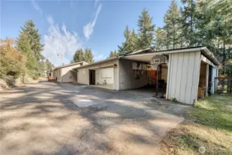 Oversized garage with storage unit or work out room. Previous owners stored their boat in the covered area.