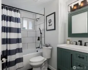 Guest bedroom with full shower and tub.