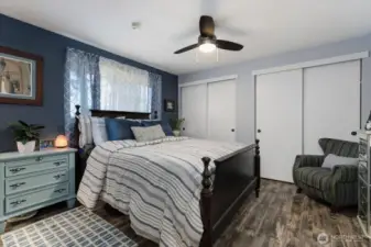 Primary bedroom with double closet and en suite bath.