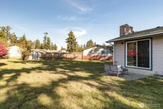 Large fenced backyard with shed and room for Accessory Dwelling Unit.
