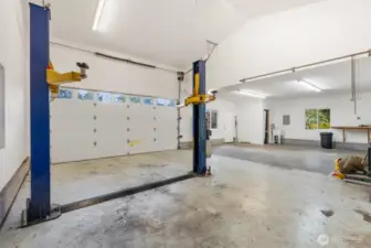 Car lift conveys if buyer wants. Shop has a half bath.