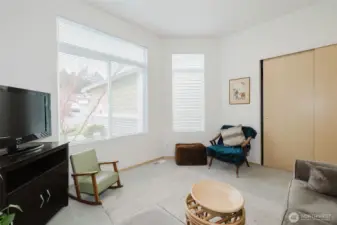 2nd bedroom with large picture windows overlooking front garden.