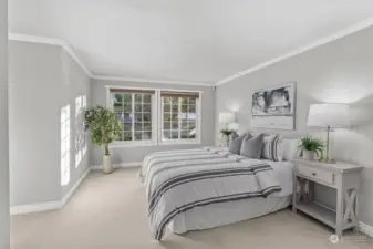 Primary bedroom with ensuite bathroom and walk-in closet